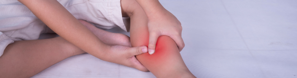 calf pain person holding it with red