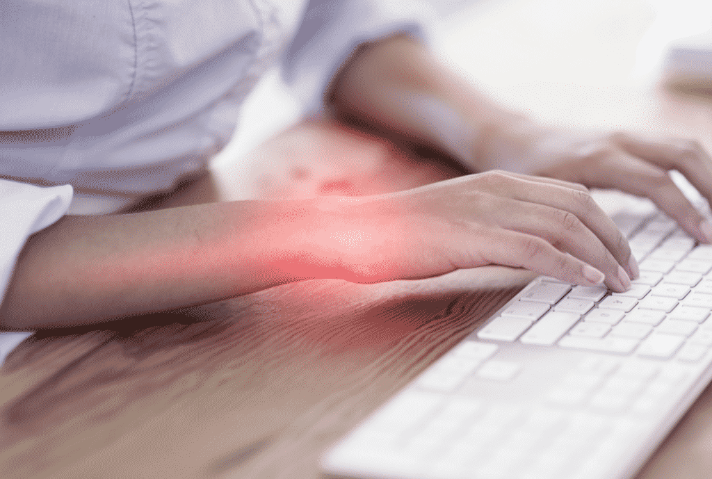 person typing with red overlay to represent wrist pain